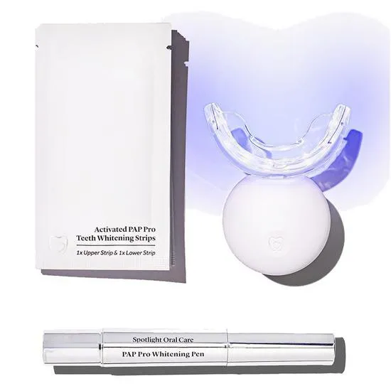 25830 woman applying teeth whitening